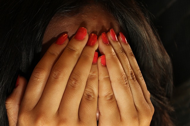 Hands over face