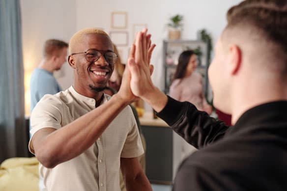 Students doing a high five