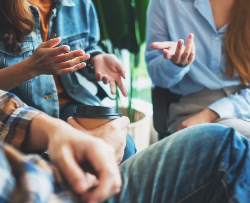 group-young-people-sitting-talking-together group-young-people-sitting-talking-together