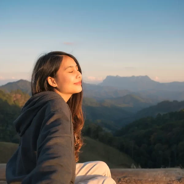 young-asian-woman-radiating-happiness-is-sitting-top-mountain-warm-sunshine-evening-national-park young-asian-woman-radiating-happiness-is-sitting-top-mountain-warm-sunshine-evening-national-park